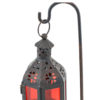 Black iron with red glass Moroccan lantern on stand.
