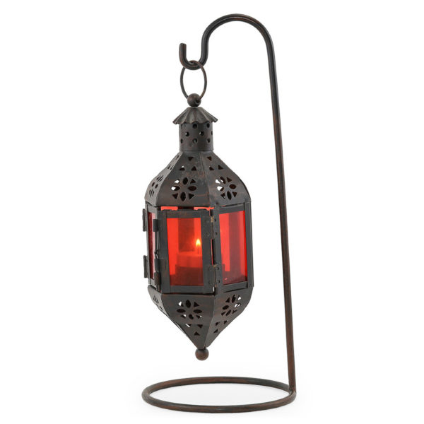 Black iron with red glass Moroccan lantern on stand.