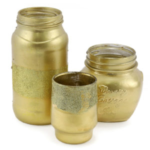 Assorted glass jars painted gold.