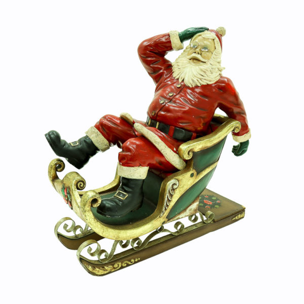 Santa in red and gold sleigh.