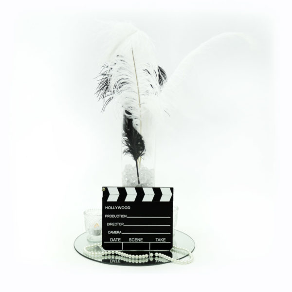 Hollywood glam centrepiece, complete with movie clapper boards, feathers, pearls and a whole lot of pizzaz!