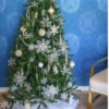 2m green Christmas tree covered with silver and blue decorations. 
Styled decorations include a snow flake topper, silver, pearl and blue baubles as well as snowflakes.  
Set up $190 | Hire $250 p/w | Removal $150 | Delivery TBC (depends on location)